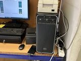 a desk with a computer and a printer on it