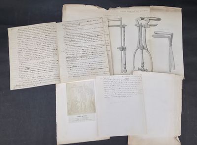 an old book with a bunch of papers on top of it