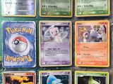 a lot of pokemon cards that are on the table