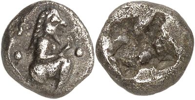 a silver coin with an image of a woman on it