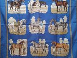 a blue banda with a picture of horses on it