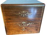 an image of a wooden box with a decorative design on it