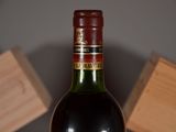a bottle of wine that is sitting on a table