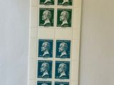 a sheet of stamps with a picture of a man on it
