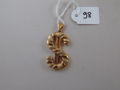 an image of a gold dollar sign ornament hanging from a string