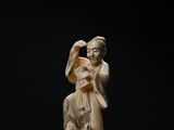 an image of a statue of a woman with a bird on her shoulder