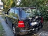 a black van parked on the side of the road