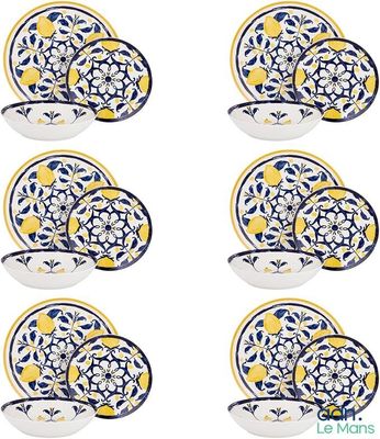 six pieces of blue and yellow floral dinnerware set on a white background