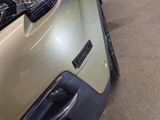 a close up of a car ' s hood with the lights on
