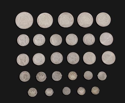 an image of a collection of silver coins on a black background