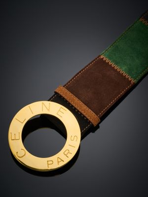 une image représentant une ceinture ornée d'un anneau en or