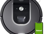 a robot vacuum cleaner with a smartphone next to it
