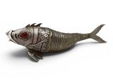 a silver fish figurine with red eyes on a white surface