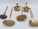 many different types of kitchen utensils on the table