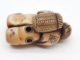 an image of a close up of a piece of wood with carvings on it