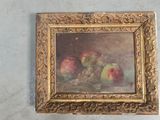 a painting of apples and grapes on the wall