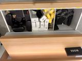 a wooden shelf with a bunch of items in it