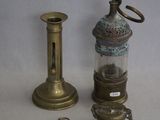 three different types of brass objects on a white surface
