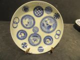 a plate with blue and white designs on it on a table