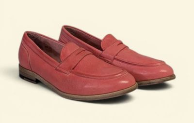 pink leather loafers with a rubber sole and a rubber outs