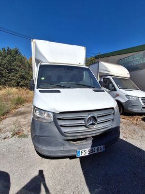 a white van that is parked in a lot