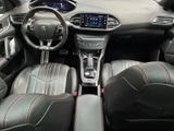 the interior of a car with black leather seats and red stitching