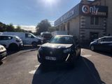 cars parked in a parking lot in front of a building
