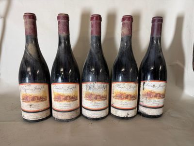 six bottles of wine are lined up in a row