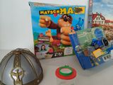 a box of game items on a table next to a box of games