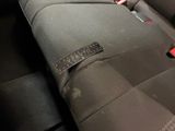 a seat in the back of a car with a sticker on it