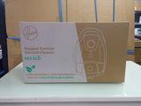 a cardboard box with a vacuum cleaner on top of it