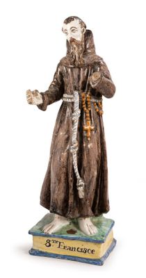 figurine of st francis of assisi on a book
