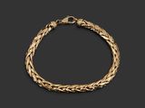 a gold bracelet with a braid design on a black background