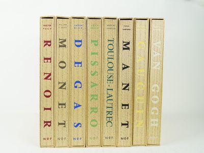 three books are stacked on top of each other on a white surface