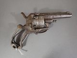 an old gun that is sitting on a table