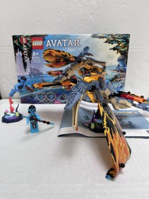 a box of legos and a toy plane on a table