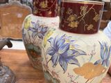 three vases that are sitting on a table