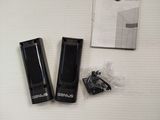 two black usb drives and a box on a white surface
