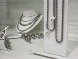 a display case with a lot of jewelry on it