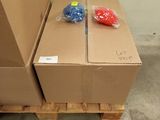 two boxes on a pallet with plastic balls on them