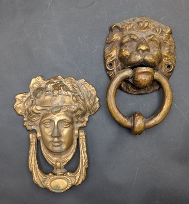 pair of antique brass lion head door knockets