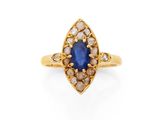bague en or ornée d'un saphir bleu et de diamants blancs
