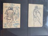 two drawings of a man and a woman on a piece of paper