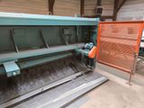a machine that is working on a piece of metal