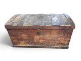 an old wooden trunk with a metal latch on it