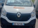 a white van that is parked on the side of the road