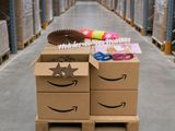 the amazon box is sitting on a pallet in a warehouse