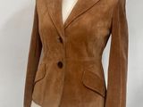 brown sued jacket on a mannequin dummy on a white background