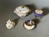 a small collection of miniature figurines sitting on a table