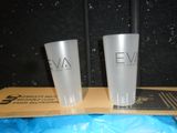 two plastic cups sitting on top of a cardboard box